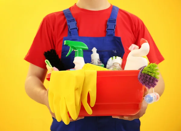 Man holding plastic basin w — Stock Photo, Image