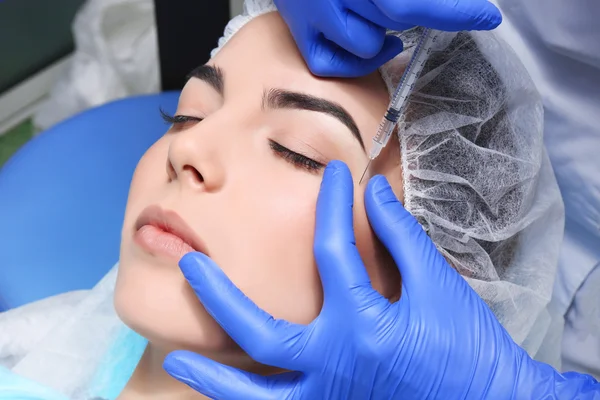 Woman receiving plastic surgery injection — Stock Photo, Image