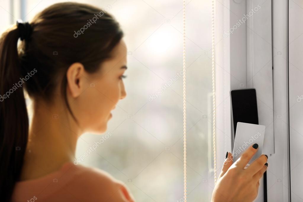 Woman setting control panel 