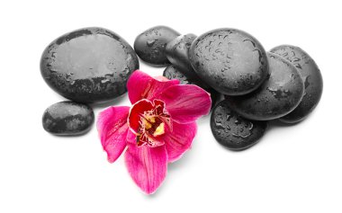 Spa taşlar ve kırmızı orkide