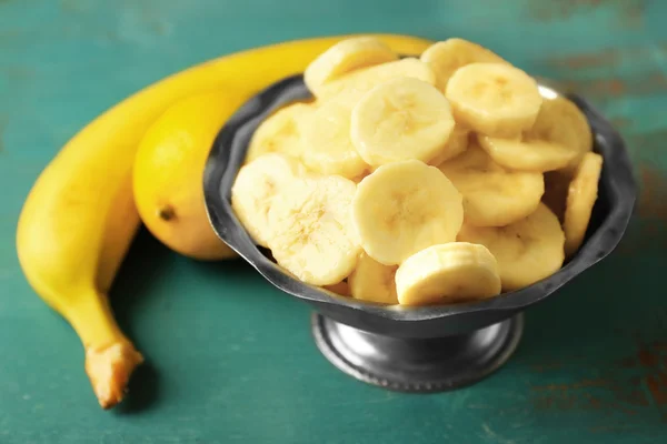 Banana slices in bowl — Stock Photo, Image