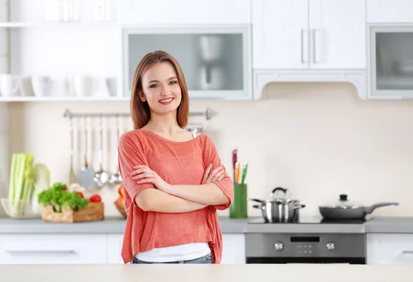 Young woman in the kitchen Royalty Free Stock Images