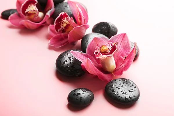 Spa stones and red orchids — Stock Photo, Image