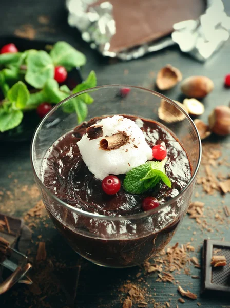 Glass cup of chocolate dessert with cranberries — Stock Photo, Image