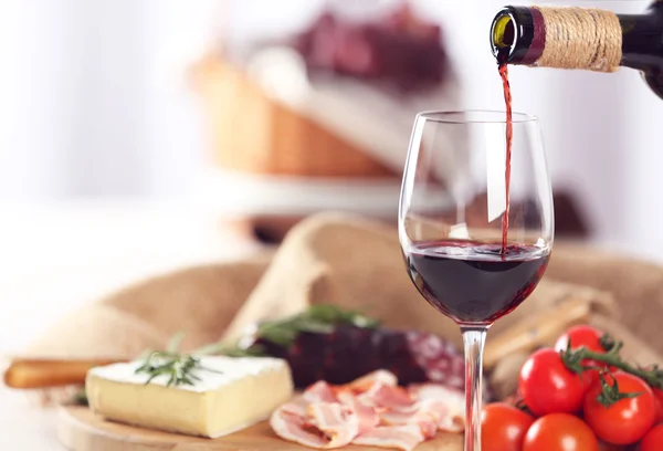 Glass of wine with food — Stock Photo, Image