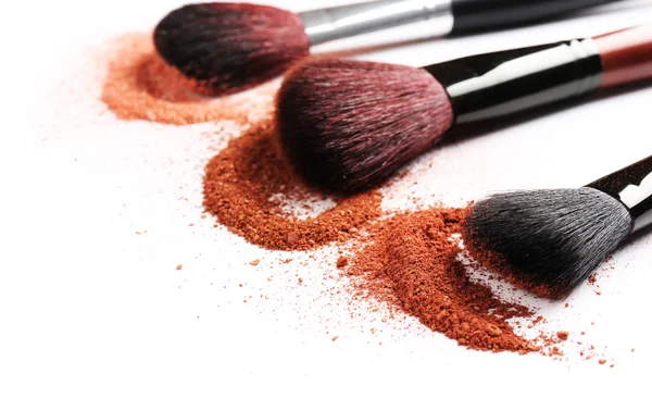 Makeup brushes with cosmetic powder — Stock Photo, Image