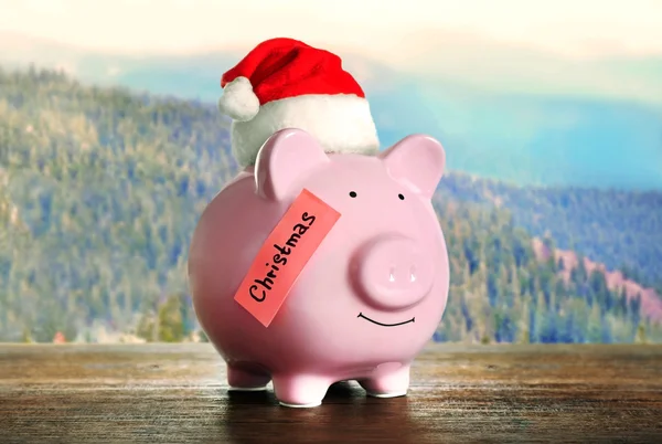 Piggy bank with Santa hat — Stock Photo, Image