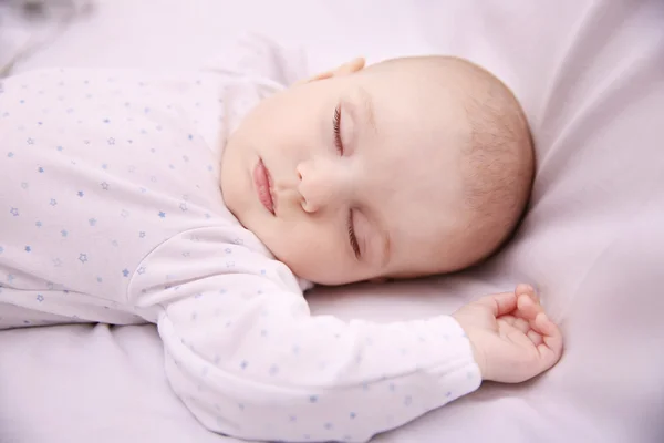 Sleeping baby in bed — Stock Photo, Image