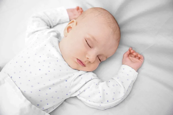 Sleeping baby in bed — Stock Photo, Image