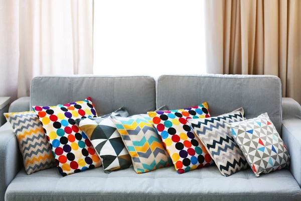 Stylish pillows on couch — Stock Photo, Image