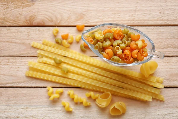 Different types of pasta on table — Stock Photo, Image