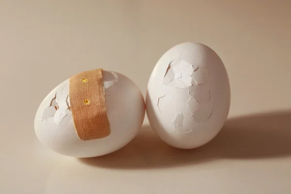 Cracked egg on background