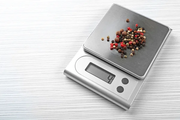 Mix of peppers with digital kitchen scales — Stock Photo, Image