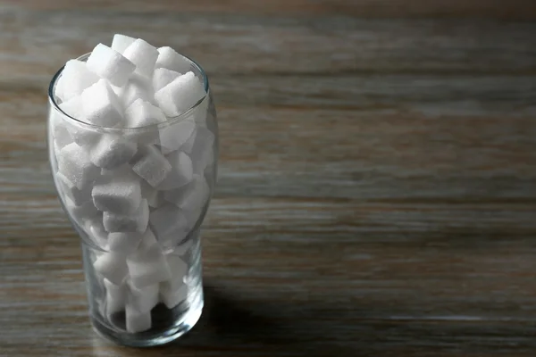 Glass with lump sugar — Stock Photo, Image