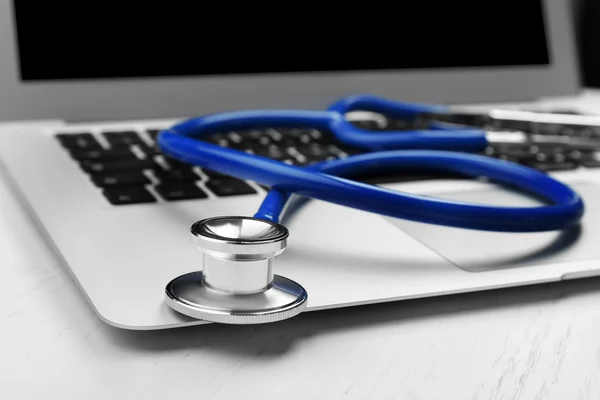 Medical Stethoscope on laptop — Stock Photo, Image