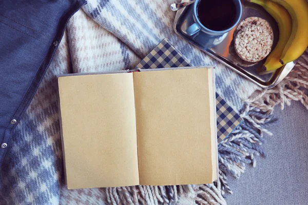 Open book, plaid and coffee — Stock Photo, Image