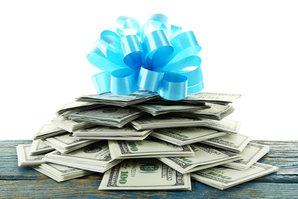 Pile of dollars with bow — Stock Photo, Image