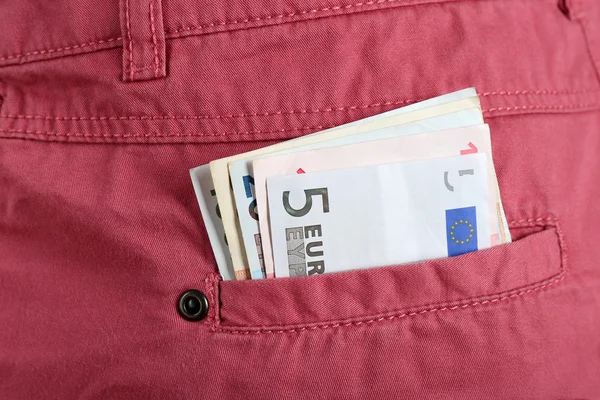 Soldi nella tasca rosa — Foto Stock