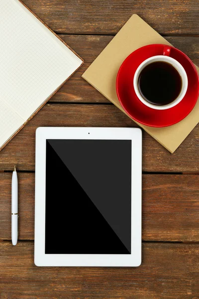 Digital tablet with cup of coffee and notebook — Stock Photo, Image