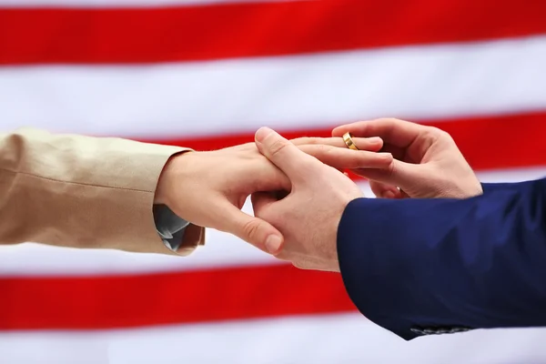 Groom puts ring on man's finger — Stock Photo, Image