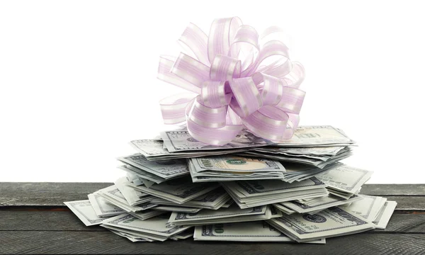 Pile of dollars with bow — Stock Photo, Image