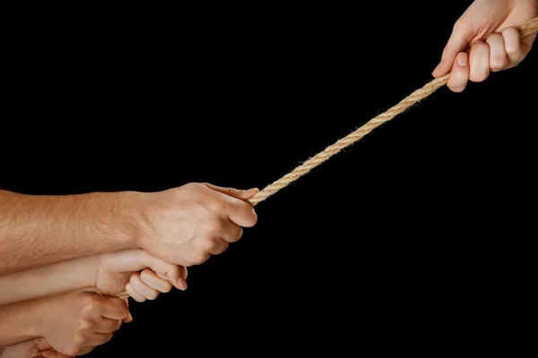 People hands pulling the rope — Stock Photo, Image