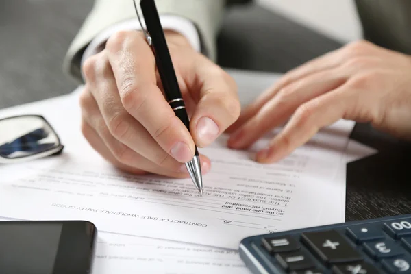 Male hand with pen signing document — Stock Photo, Image