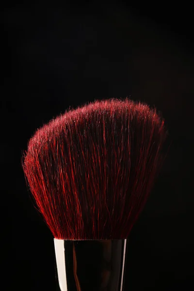 Makeup brush on black — Stock Photo, Image