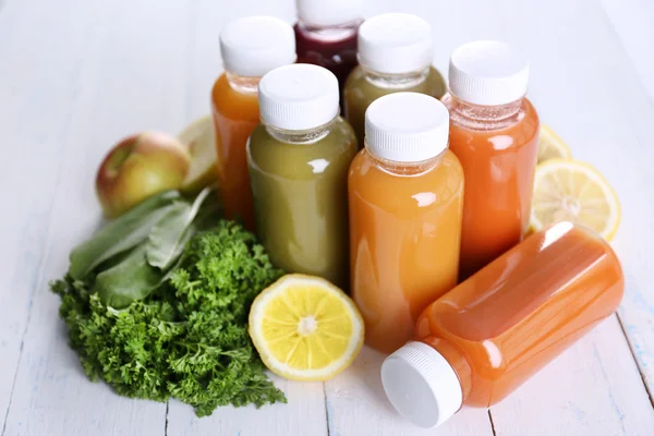 Diet concept: vegetable juices in bottles — Stock Photo, Image
