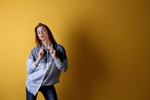 Young woman in shirt and jeans — Stock Photo, Image