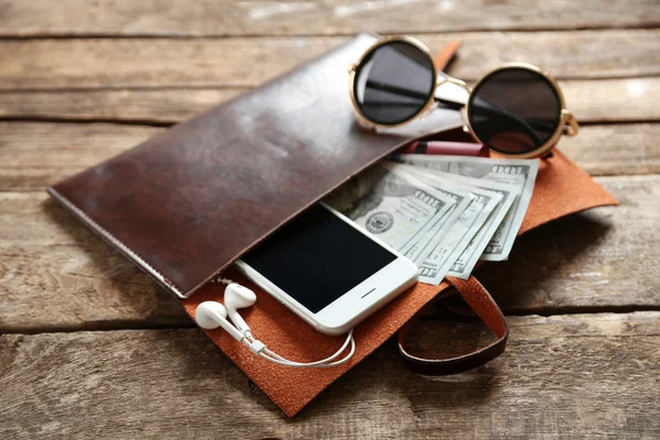 Leather purse with mobile phone — Stock Photo, Image