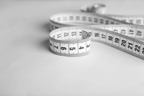 Measuring tape on white — Stock Photo, Image