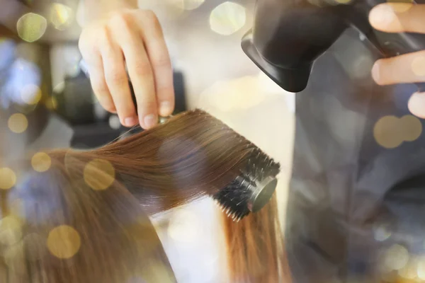 Hairdresser drying hair — Stock Photo, Image