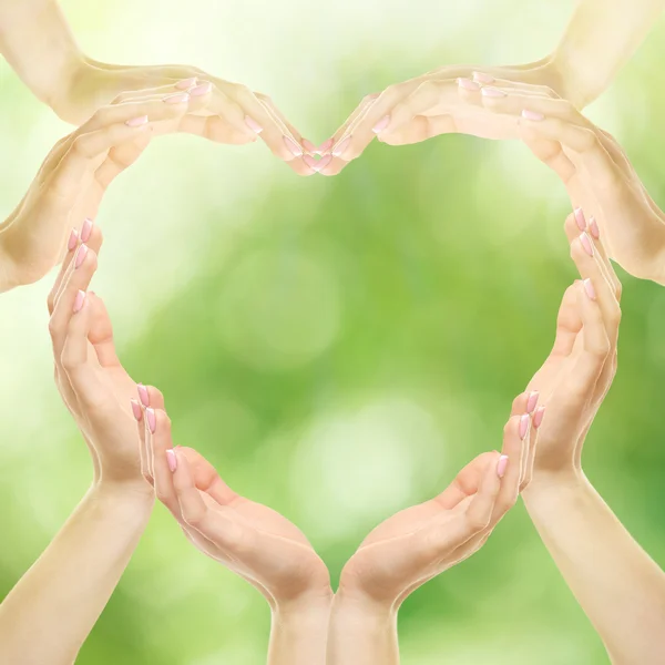 Female hands in heart shape — Stock Photo, Image