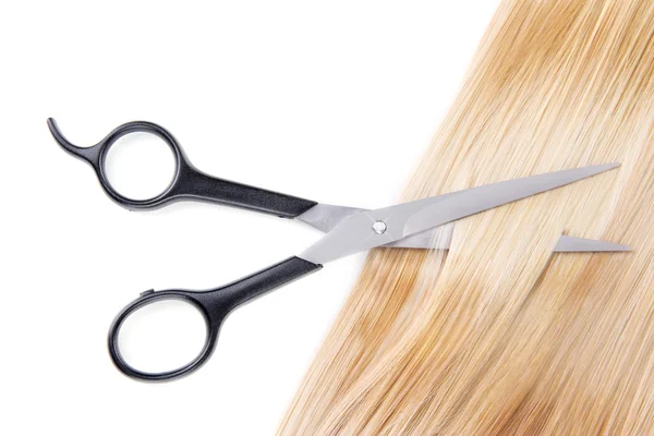 Long blond hair and scissors Royalty Free Stock Images