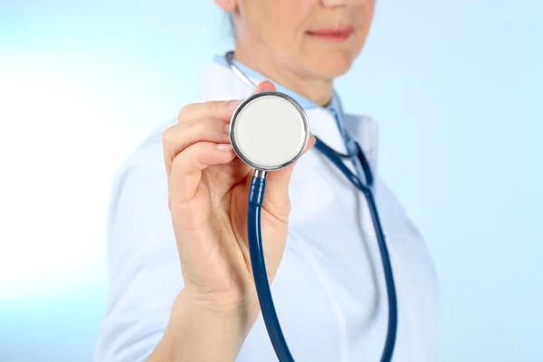 Professional doctor with stethoscope Stock Image