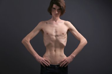 Skinny young man with anorexia  clipart