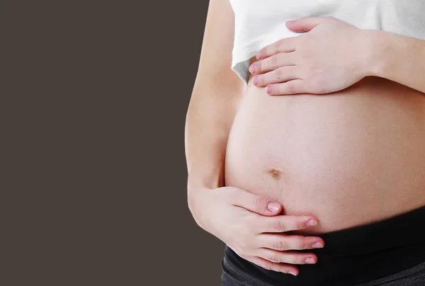 Mujer embarazada de cerca — Foto de Stock