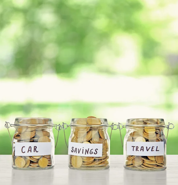 Three jars full of coins — Stock Photo, Image