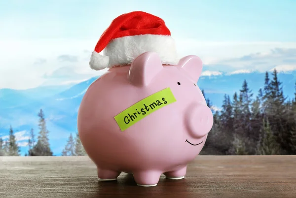 Piggy bank with Santa hat — Stock Photo, Image