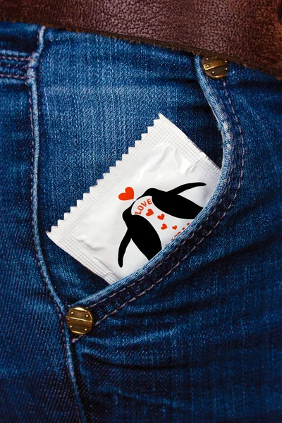 Condom in pocket of jeans — Stock Photo, Image