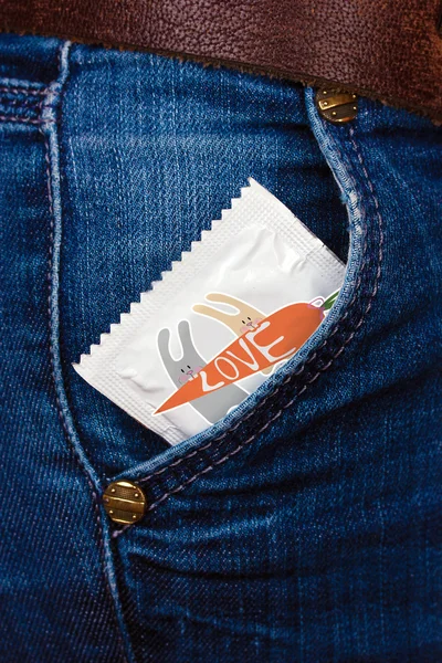 Condom in pocket of jeans — Stock Photo, Image