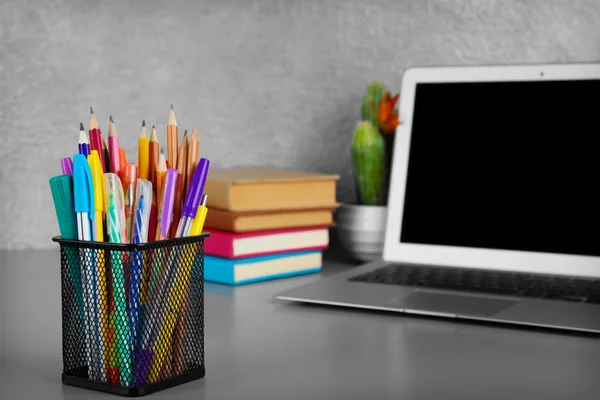 Pencils and pens in metal holder — Stock Photo, Image