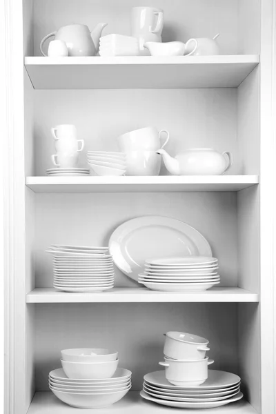 Dishes in cupboard in the kitchen — Stock Photo, Image