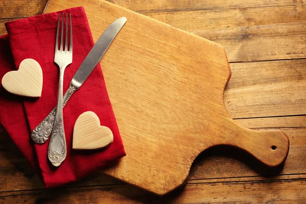 Composition of fork, knife, napkin — Stock Photo, Image