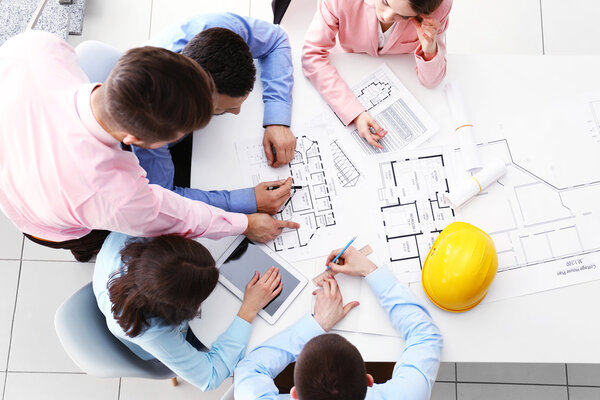 Young engineers working in the office, top view