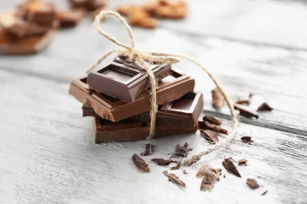 Chocolate pieces on  background — Stock Photo, Image