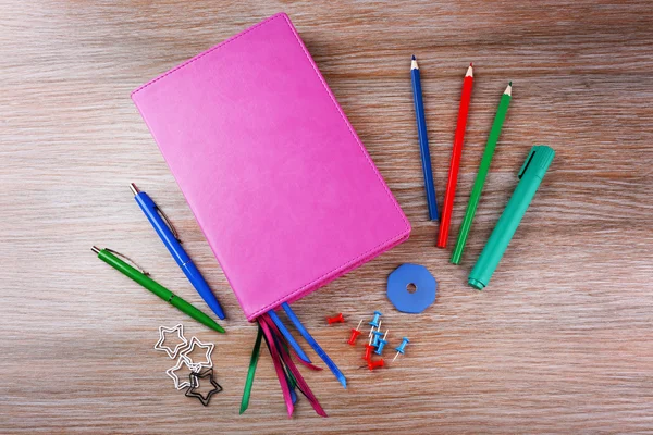 Notebook with stationery on  background — Stock Photo, Image