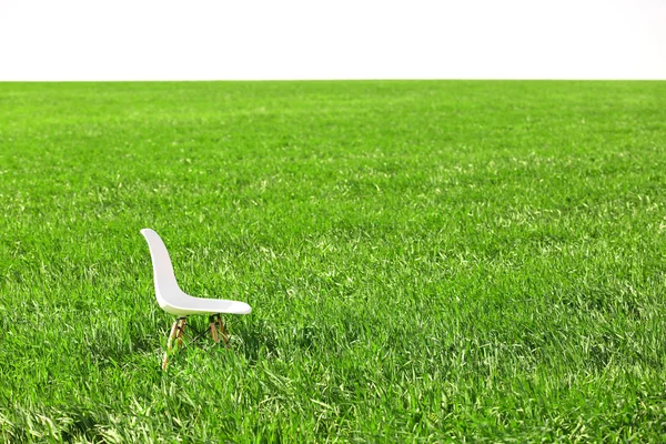 White wooden chair on the field — Stock Photo, Image