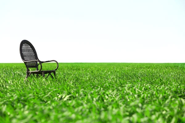 Black chair on field — Stock Photo, Image